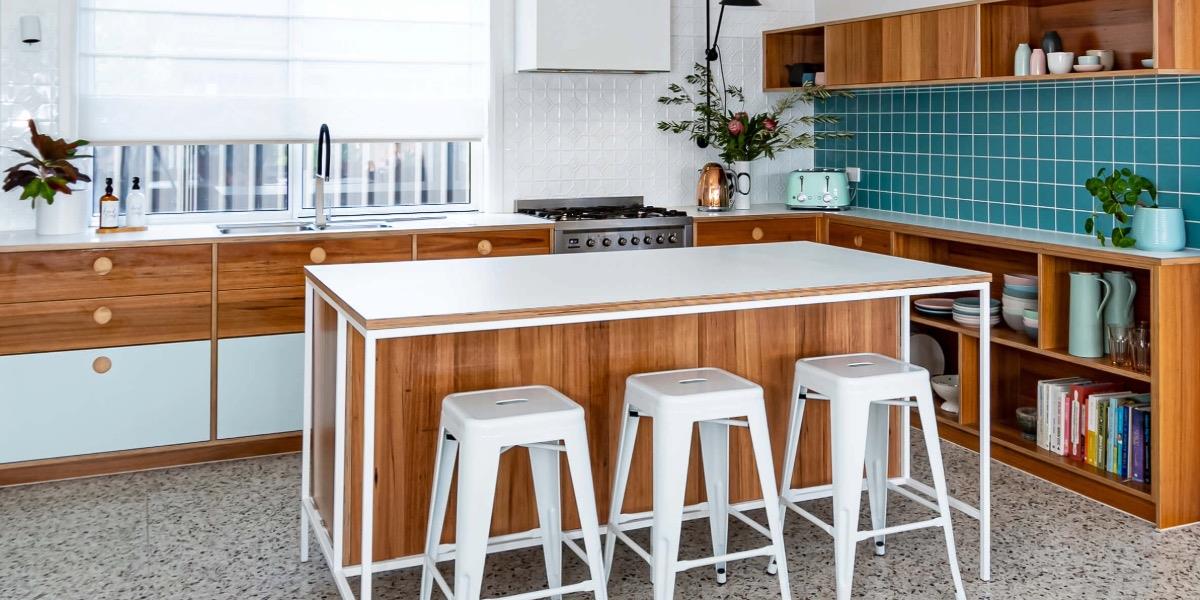 ACT designer Jo Tuck-Lee of Marble & Muse Interiors used the full-bodied colour of porcelain tiles to add a turquoise treat to this beautiful kitchen.